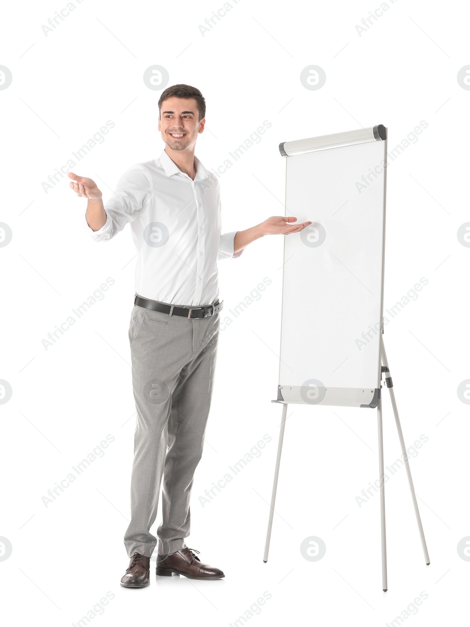 Photo of Business trainer giving presentation on flip chart board against white background