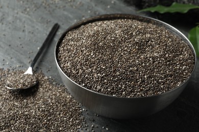 Photo of Metal bowl with chia seeds on table