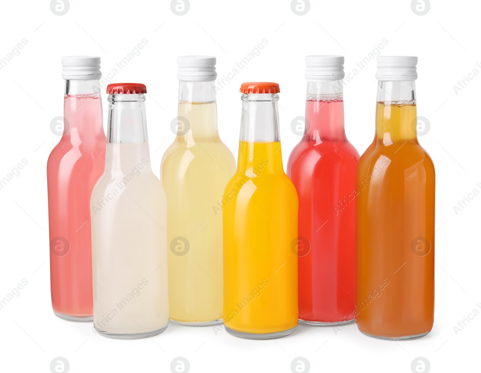 Photo of Delicious kombucha in glass bottles isolated on white