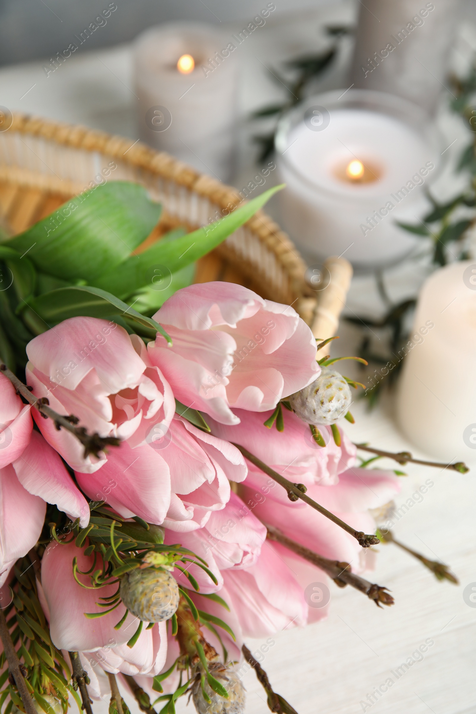 Photo of Beautiful bouquet with spring pink tulips on table, closeup