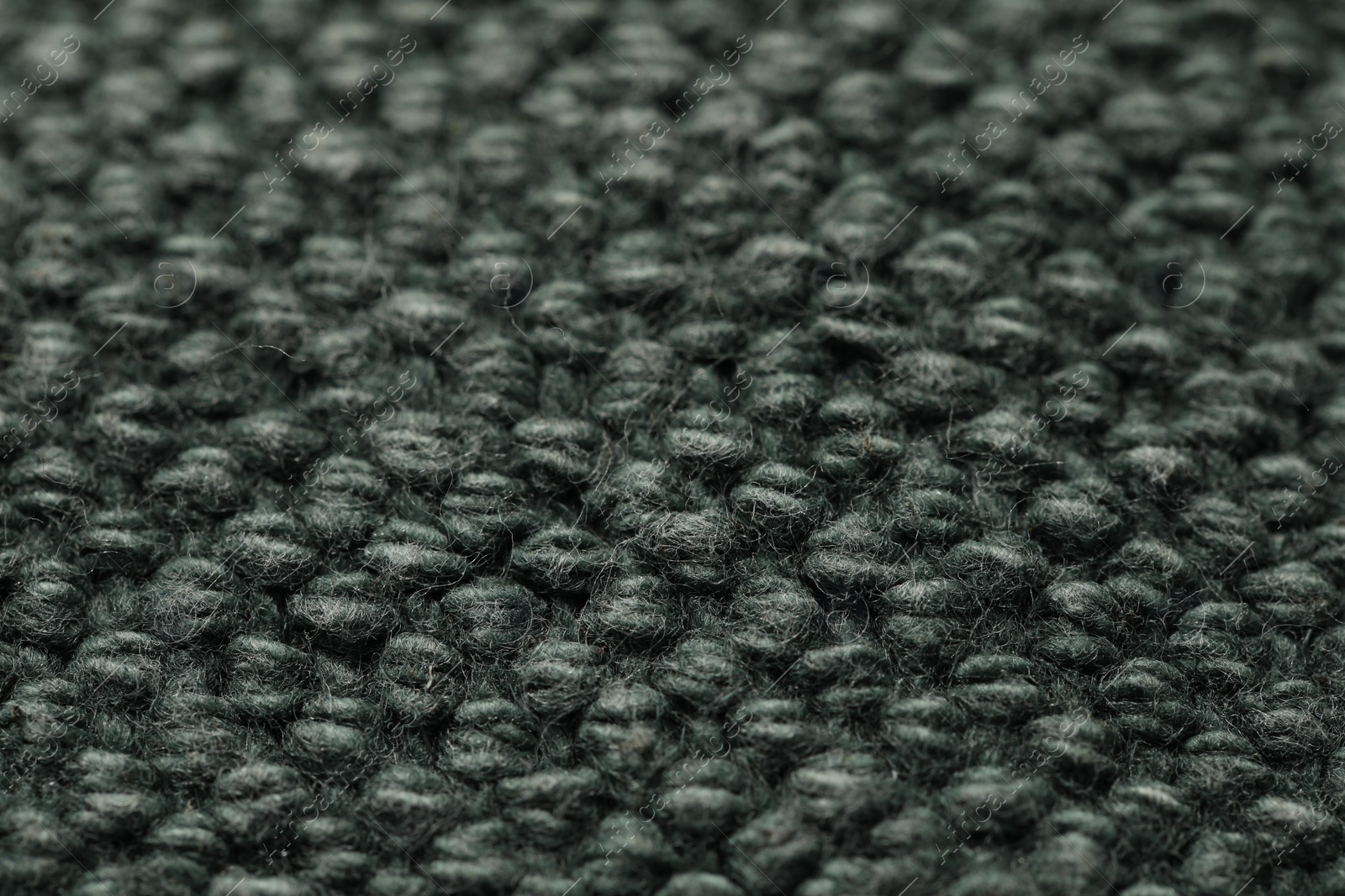 Photo of Texture of soft grey knitted fabric as background, closeup