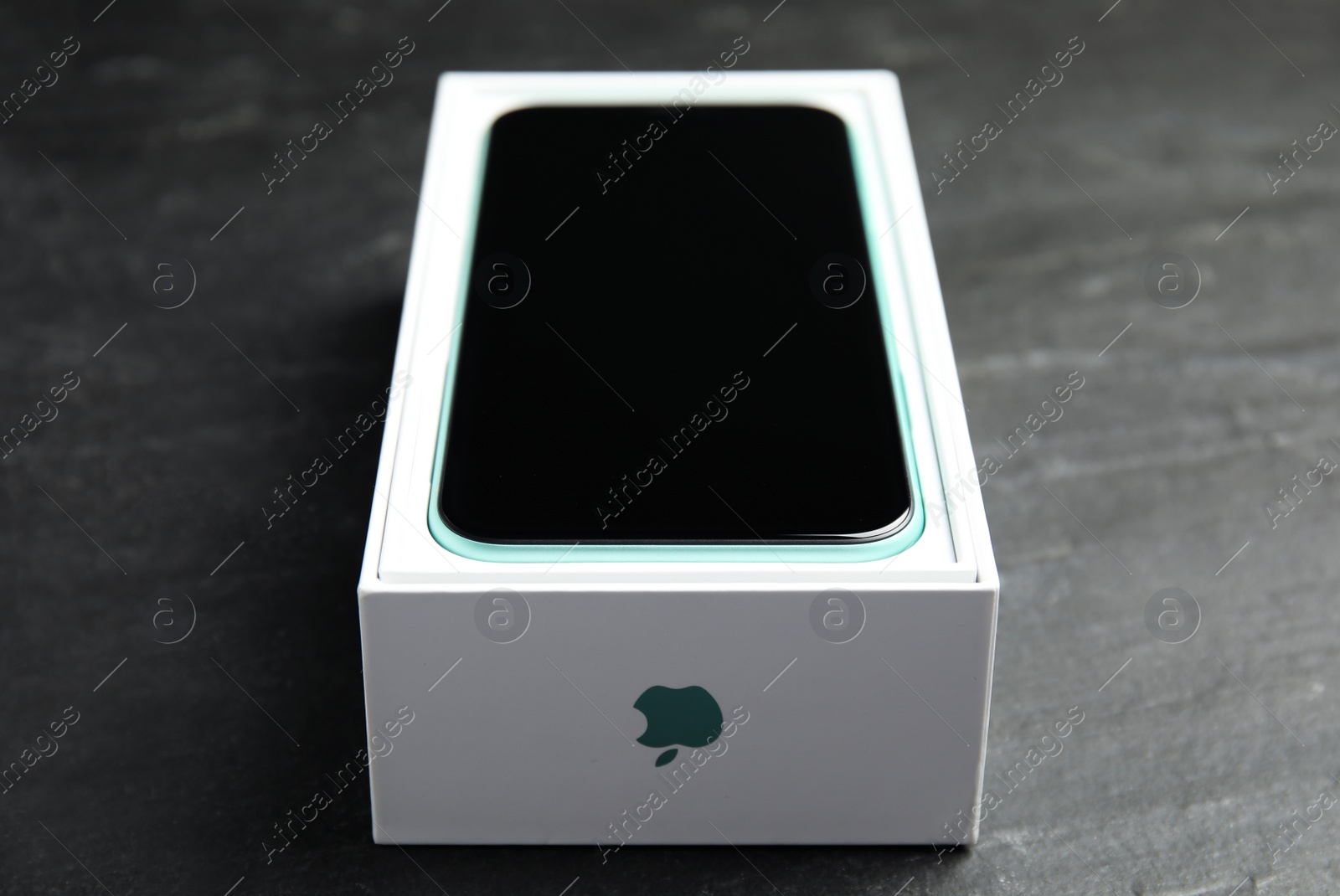 Photo of MYKOLAIV, UKRAINE - JULY 10, 2020: New modern Iphone 11 in original box on grey table