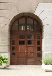 Photo of Building with vintage wooden door. Exterior design