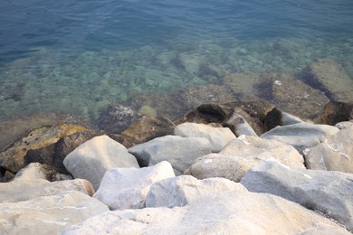 Photo of Beautiful view of sea coast with stones on summer day