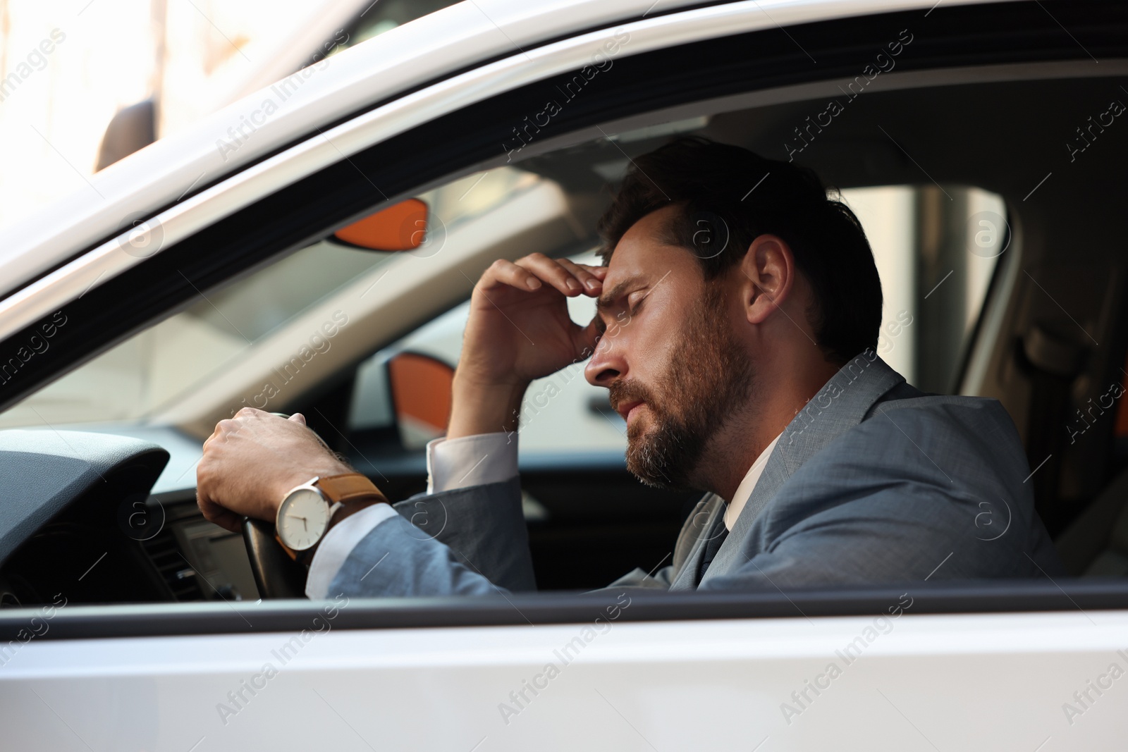 Photo of Stuck in traffic jam. Stressed driver in his car, view from outside