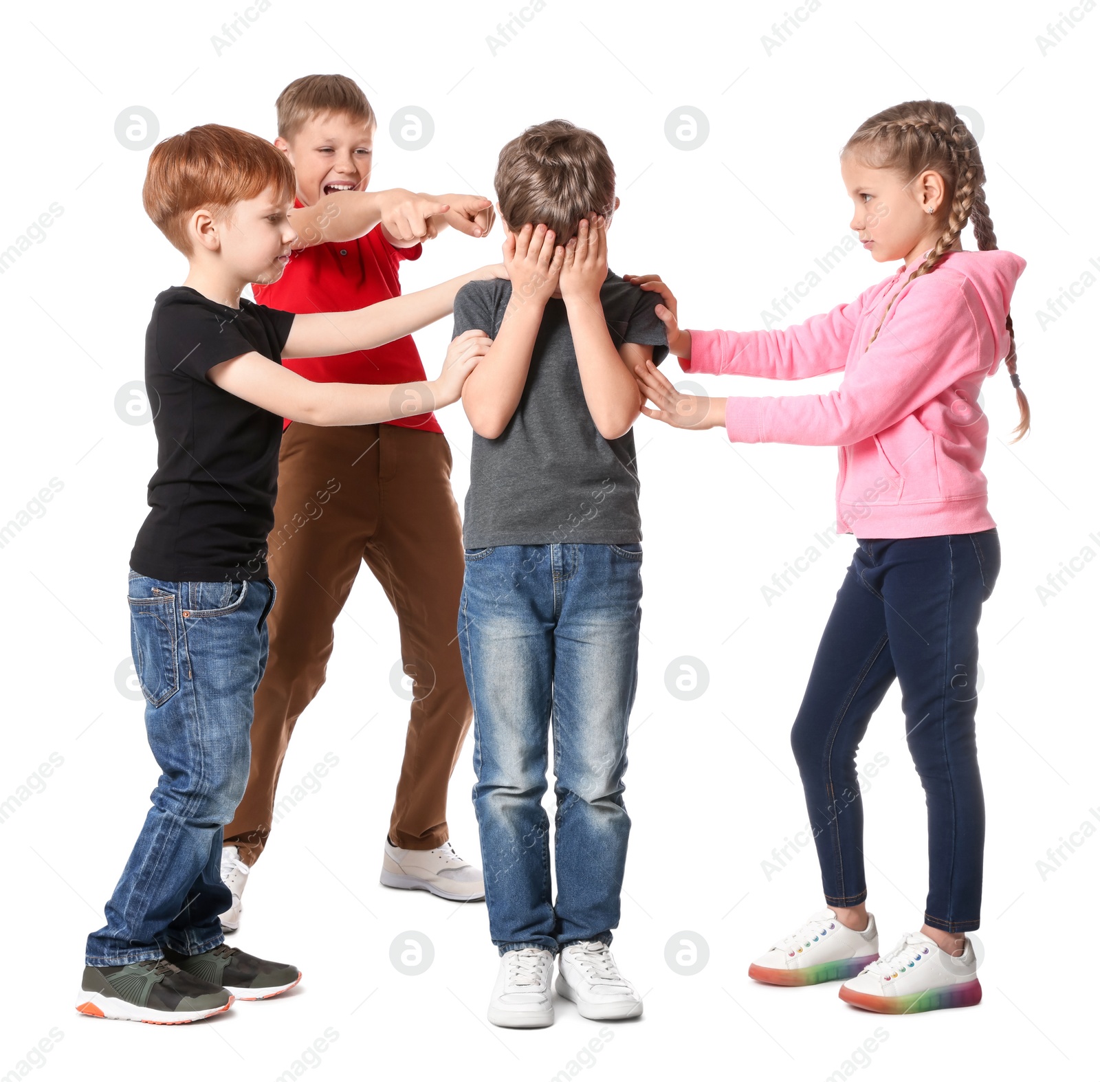 Photo of Kids bullying upset boy on white background