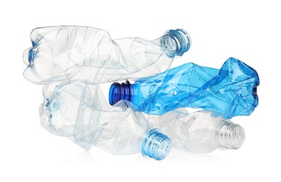 Photo of Crumpled disposable plastic bottles isolated on white