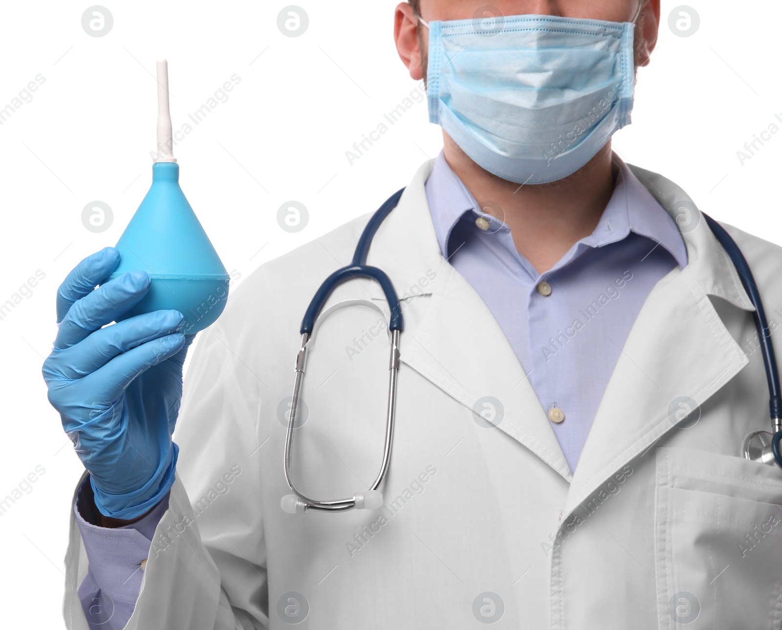 Photo of Doctor holding light blue enema on white background, closeup