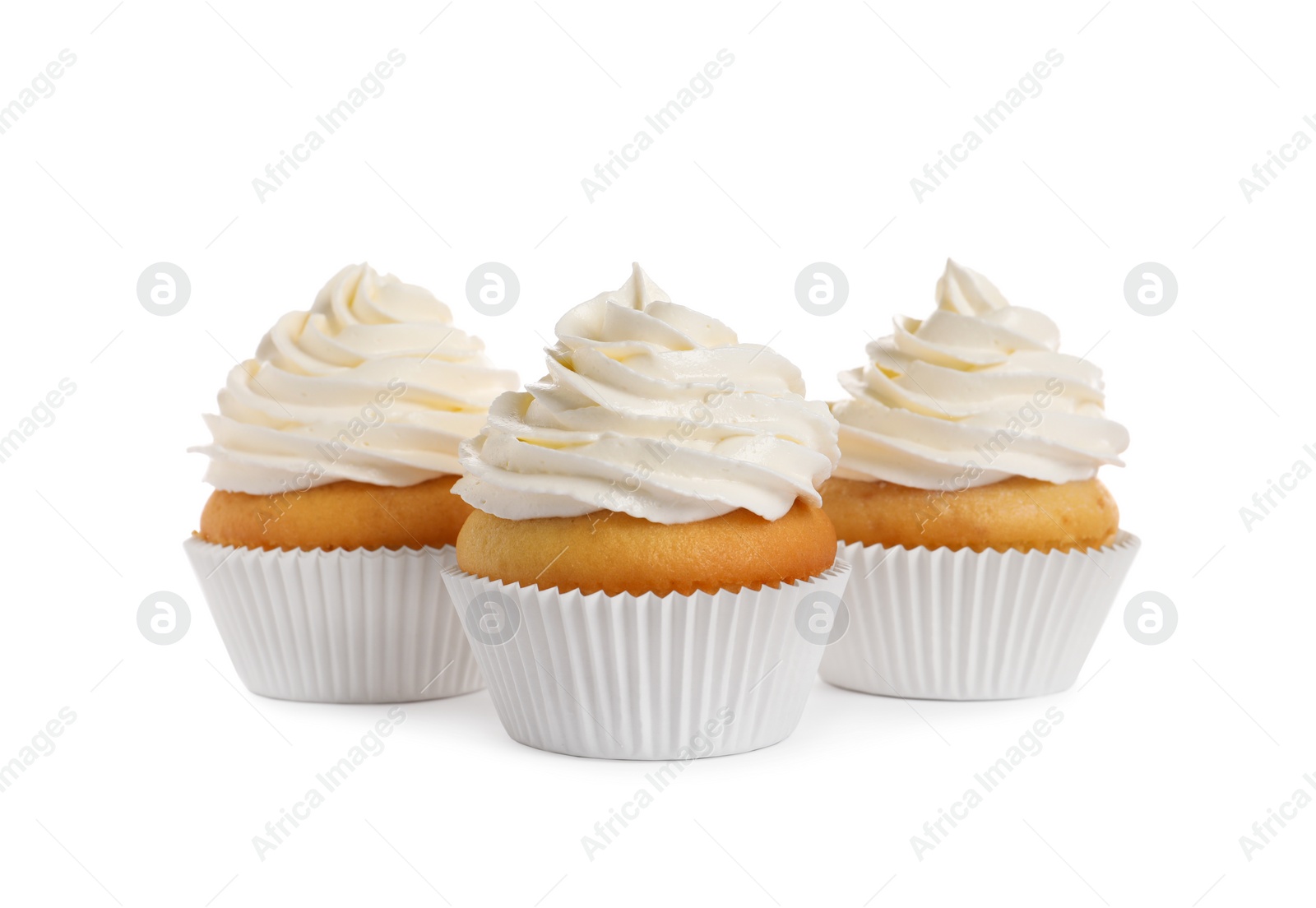 Photo of Delicious cupcakes decorated with cream on white background