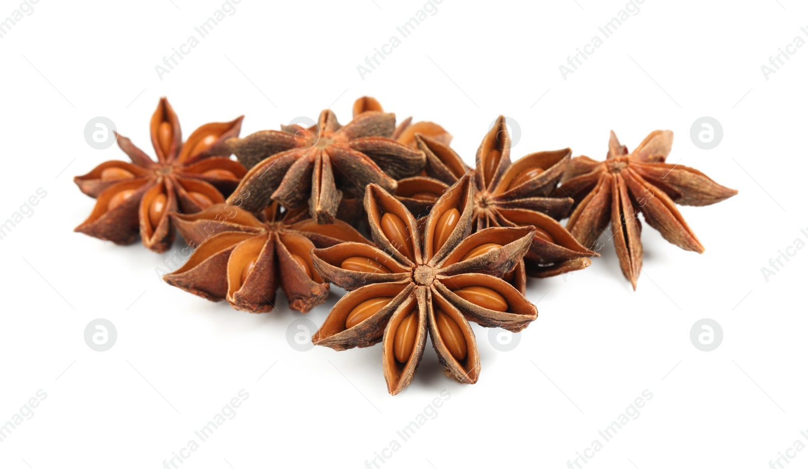 Photo of Dry anise stars with seeds on white background