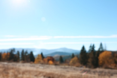 Picturesque landscape with beautiful forest and mountains, blurred view