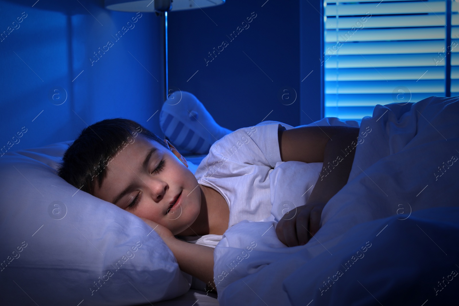 Photo of Cute little boy sleeping at home. Bedtime