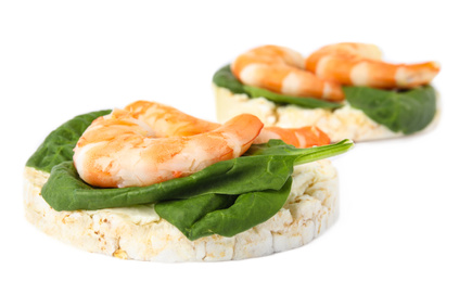Photo of Puffed rice cakes with shrimps and basil isolated on white