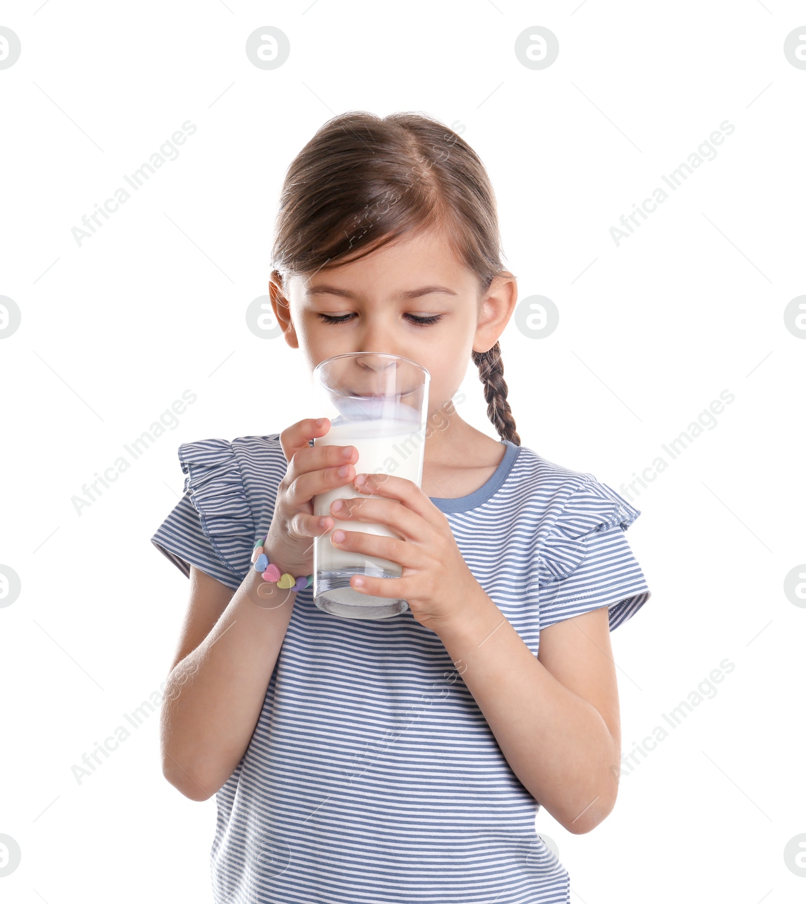 Photo of Cute little girl drinking milk on white background