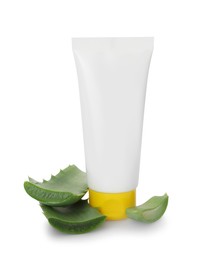 Photo of Tube of natural cream and cut aloe leaf isolated on white