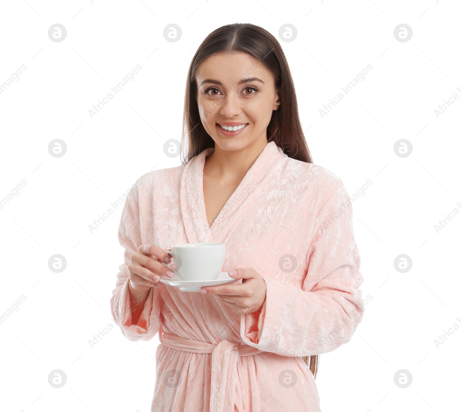 Photo of Young woman in bathrobe with cup of beverage on white background