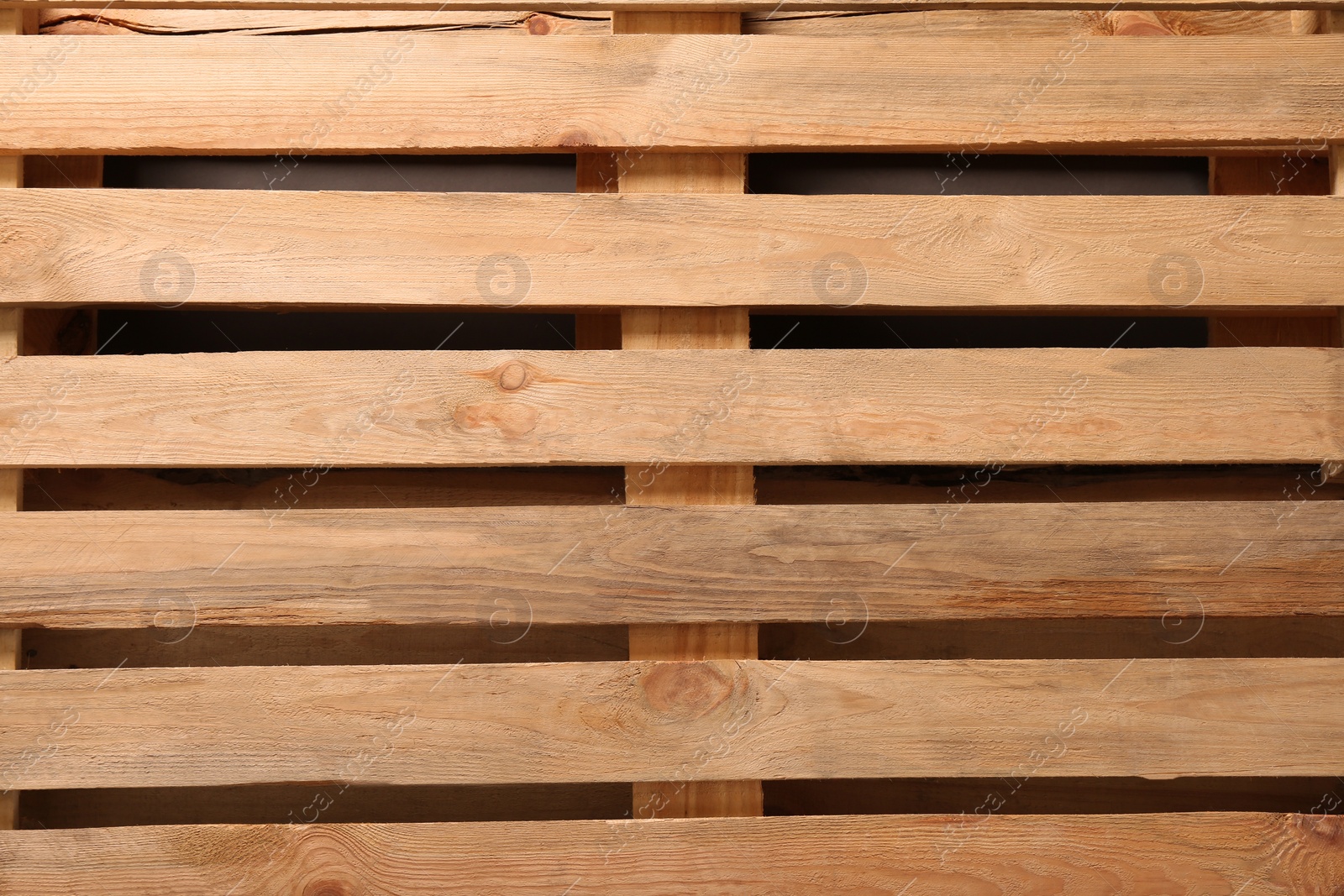 Photo of Wooden pallet as background, top view. Transportation and storage