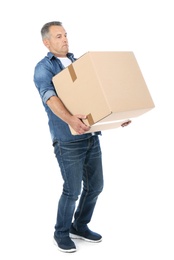 Full length portrait of mature man carrying carton box on white background. Posture concept