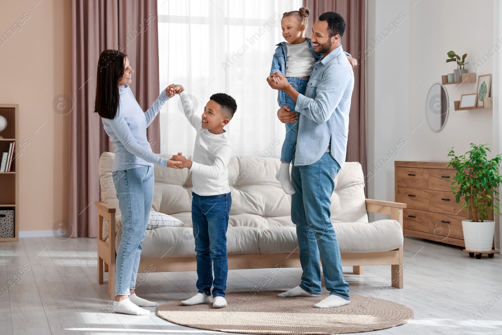 Photo of Happy international family spending time together at home