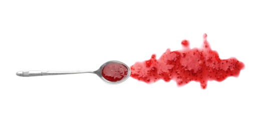 Spoon and sweet raspberry jam on white background