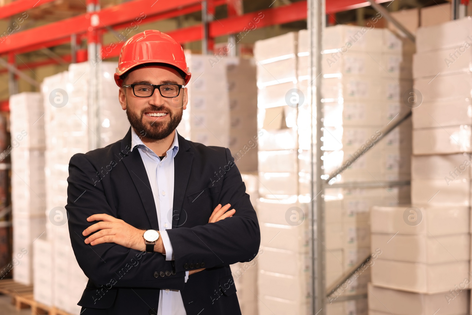 Image of Manager in hardhat at warehouse. Logistic center