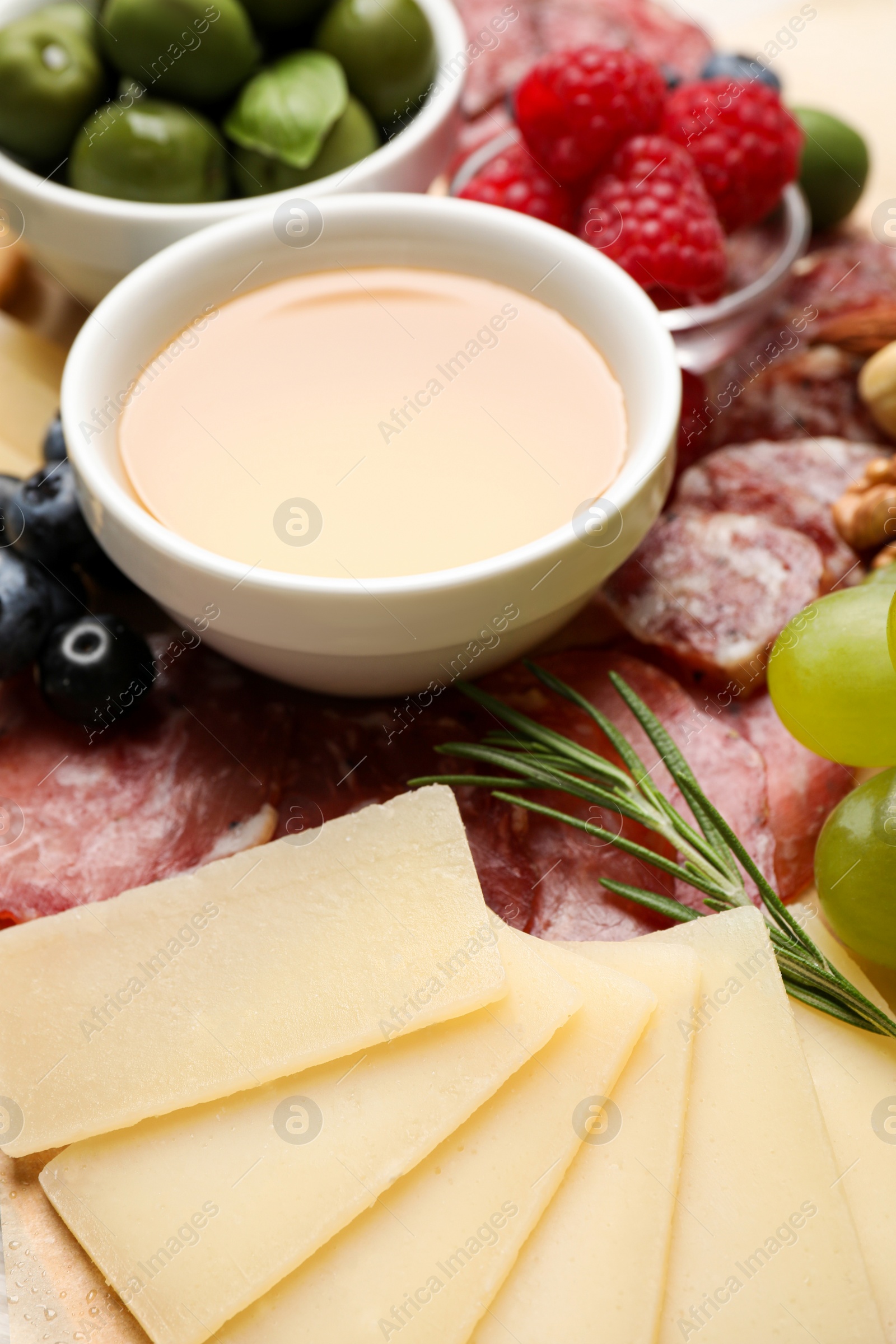 Photo of Snack set with delicious Parmesan cheese, closeup