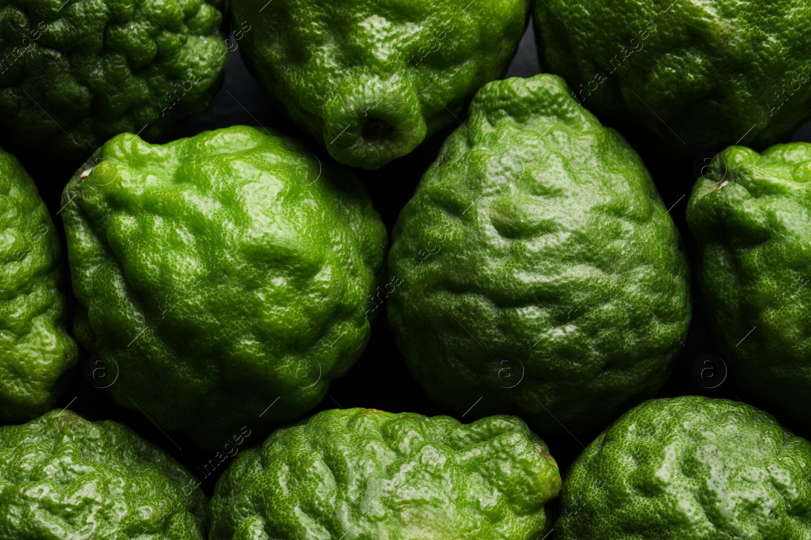 Photo of Fresh ripe bergamot fruits as background, top view