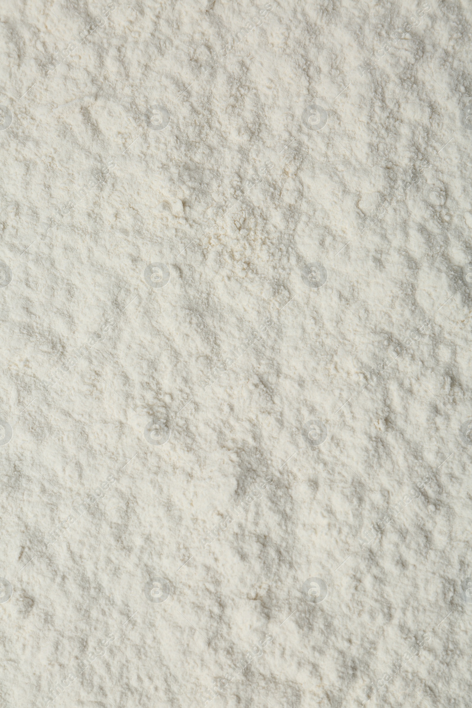 Photo of Pile of organic flour as background, top view