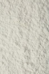 Pile of organic flour as background, top view