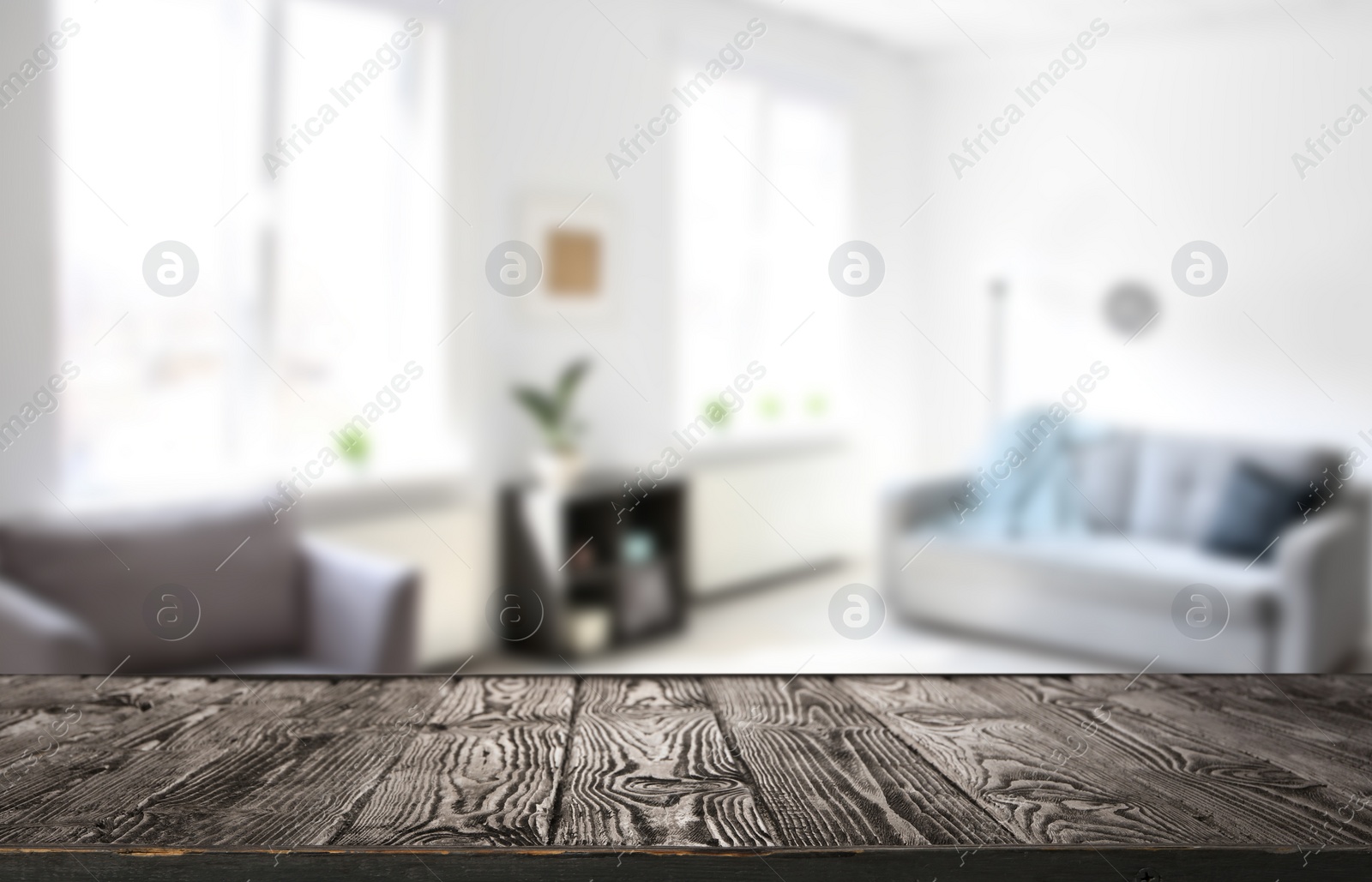 Image of Empty wooden surface and blurred view of room with modern windows