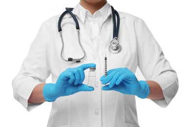 Photo of Doctor holding medical syringe and glass vial on white background, closeup