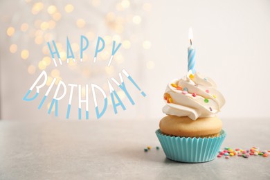 Image of Happy Birthday! Delicious cupcake with candle on light background