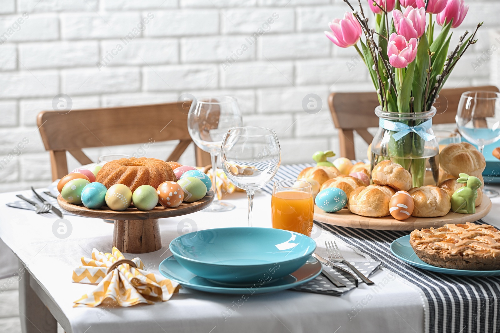 Photo of Festive Easter table setting with traditional meal at home