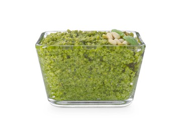 Delicious pesto sauce in bowl isolated on white