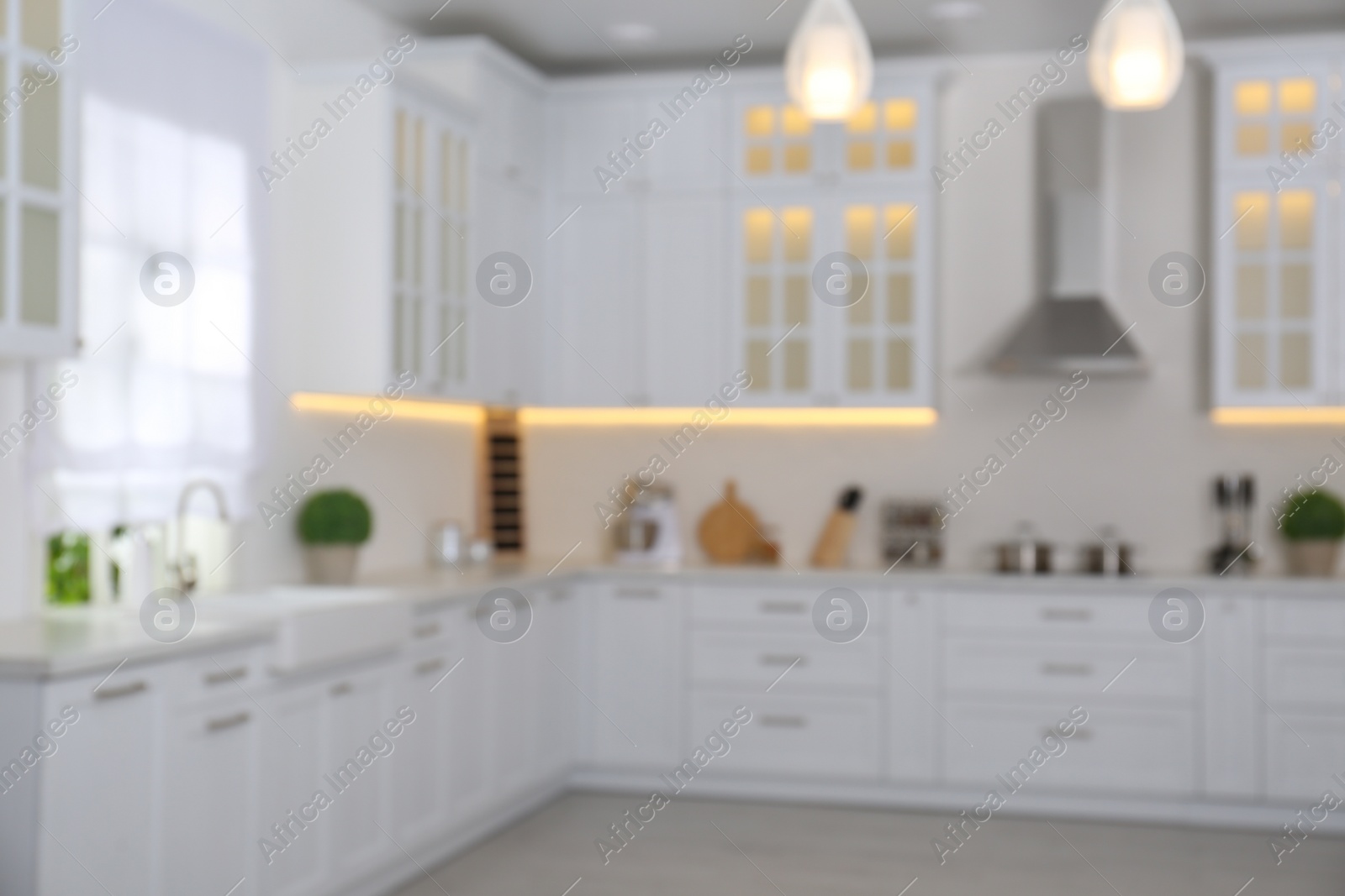 Photo of Blurred view of modern stylish kitchen interior