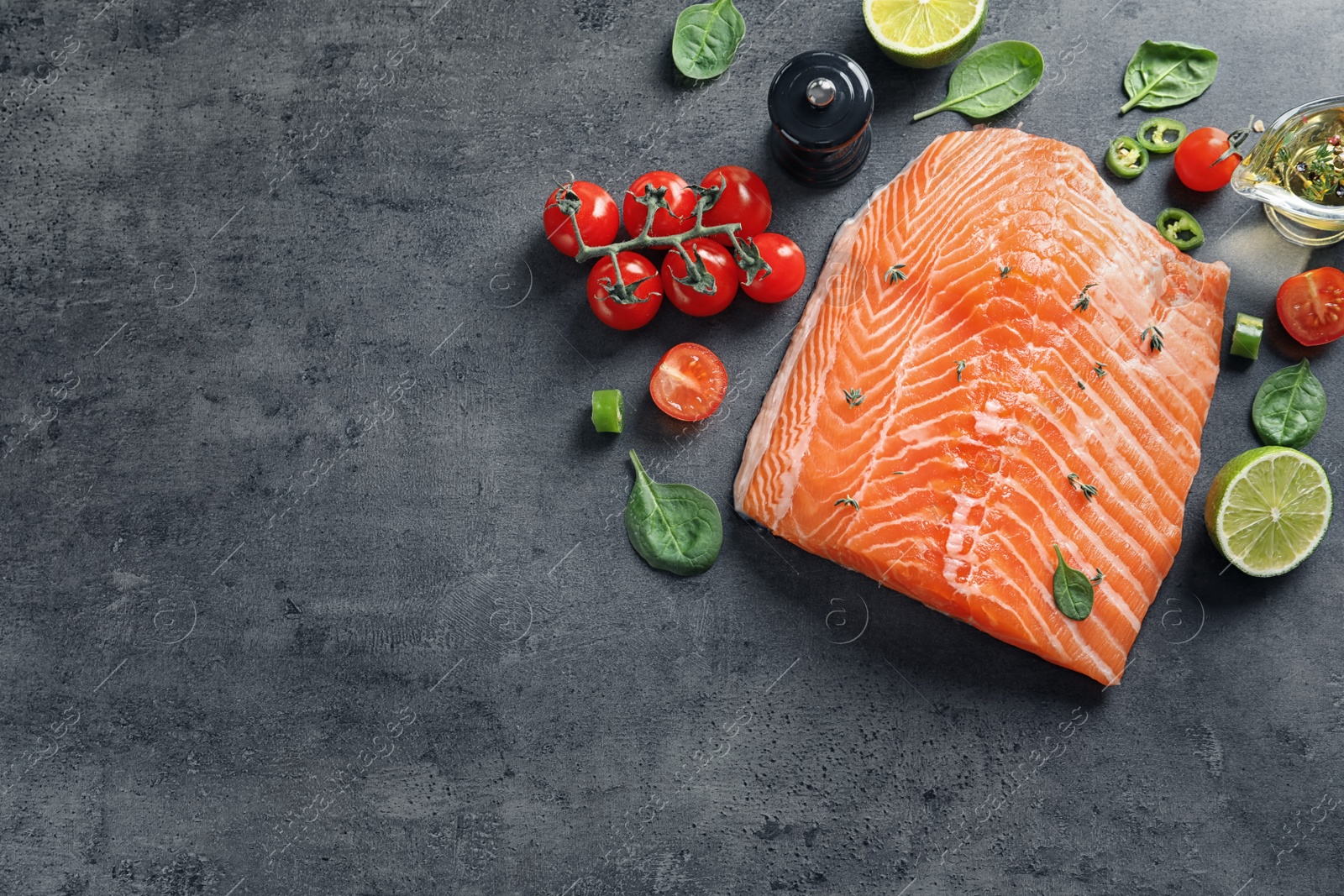 Photo of Flat lay composition with raw salmon and ingredients for marinade on table