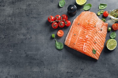 Photo of Flat lay composition with raw salmon and ingredients for marinade on table