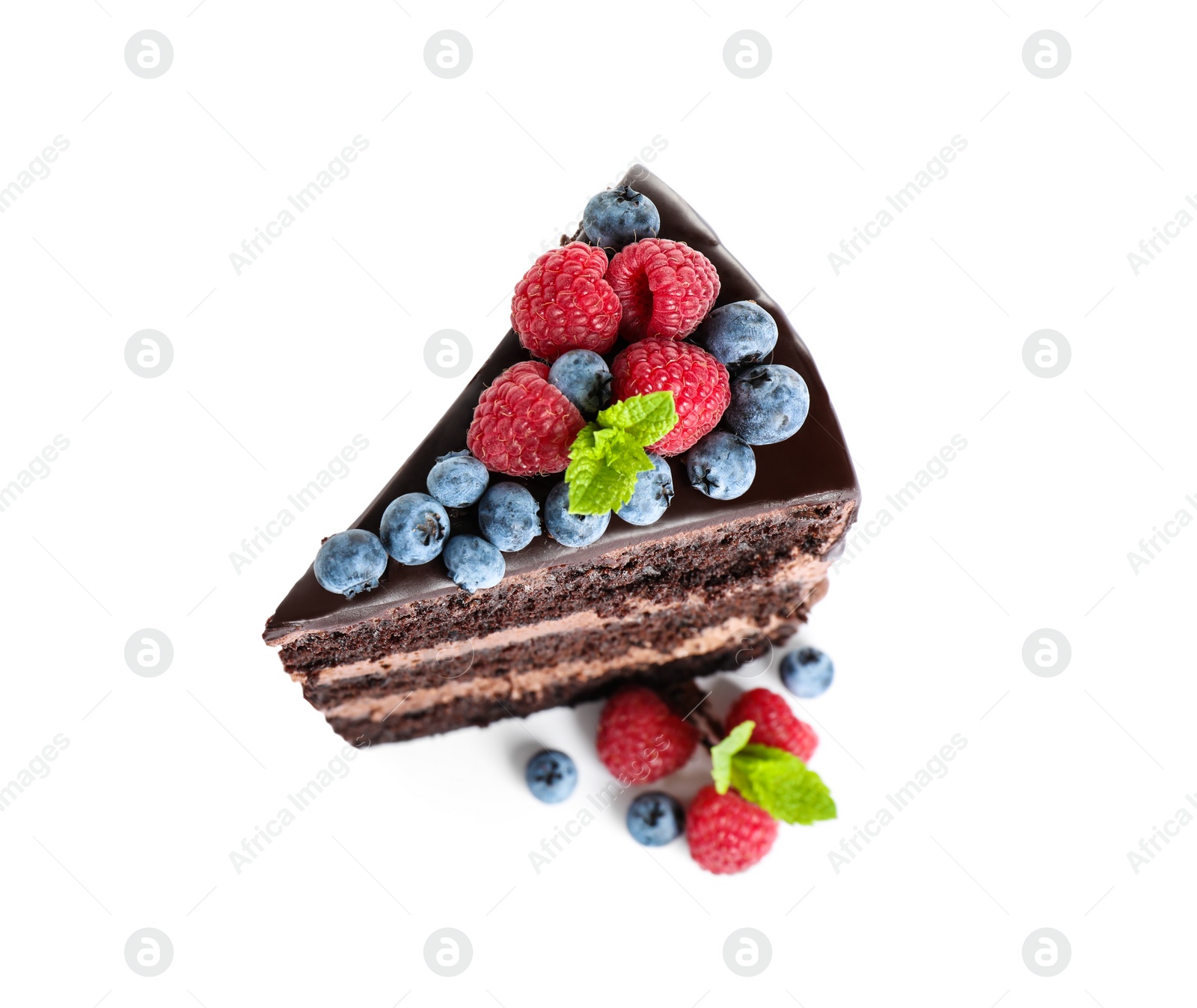 Photo of Piece of delicious chocolate cake decorated with fresh berries on white background, above view