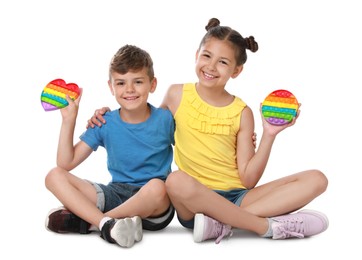 Children with pop it fidget toys on white background