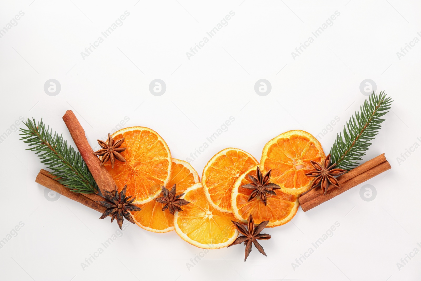 Photo of Flat lay composition with dry orange slices, anise stars and cinnamon sticks on white background. Space for text