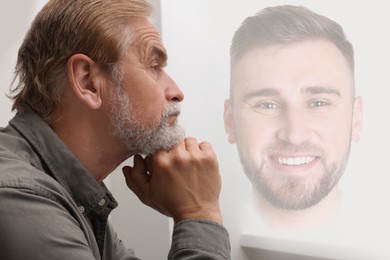Image of Mature man remembering old times. Translucent picture of young guy showing him in his youth