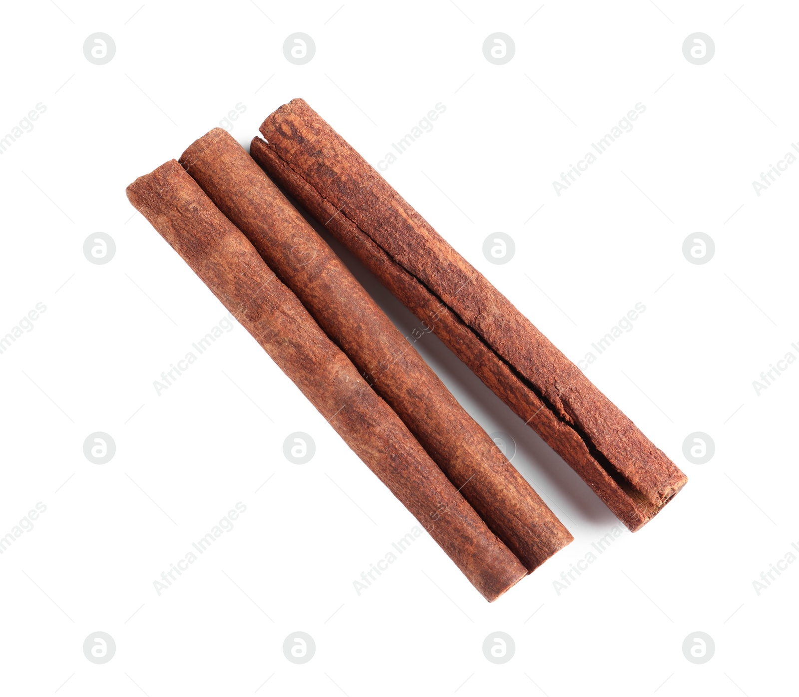 Photo of Cinnamon sticks isolated on white, top view