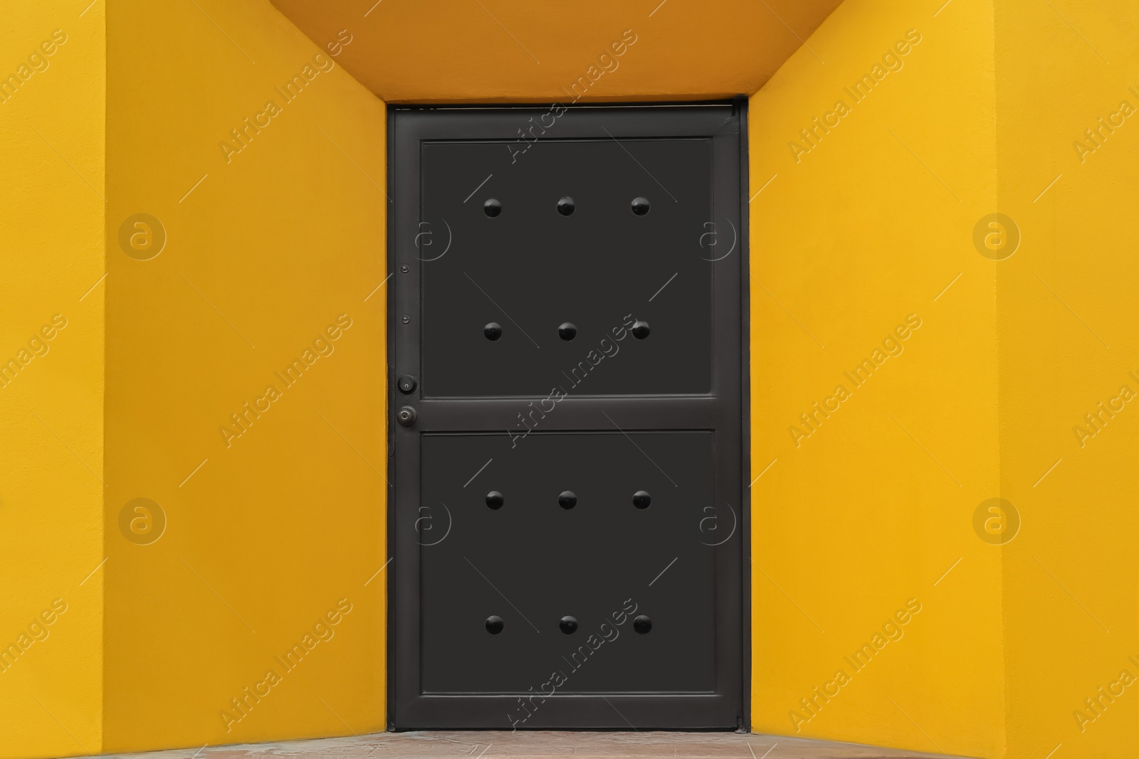 Photo of Entrance of house with beautiful brown metal door