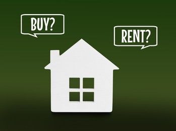 Model of house and speech bubbles with words Buy and Rent on green background