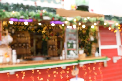 Blurred view of Christmas fair stall outdoors