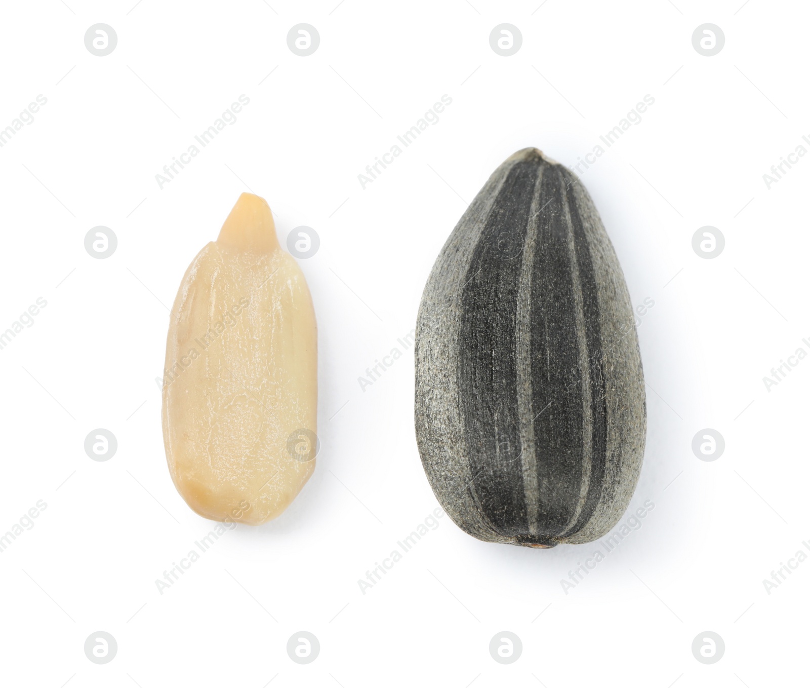 Photo of Raw peeled and unpeeled sunflower seed isolated on white, top view