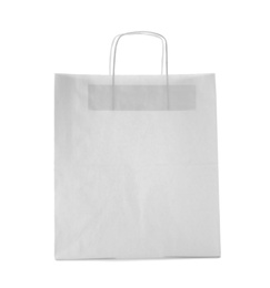 Photo of Mockup of paper shopping bag on white background