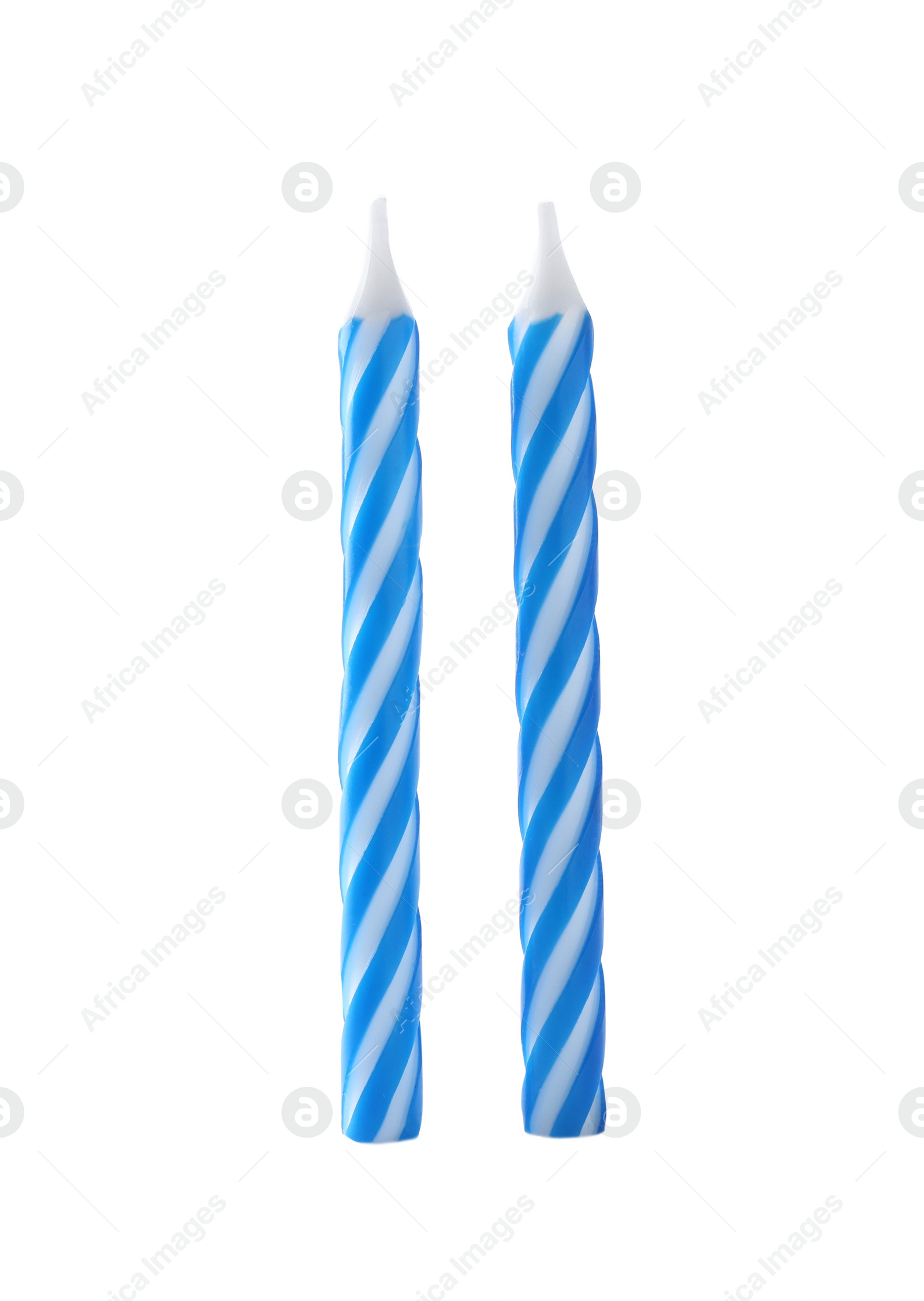 Photo of Blue striped birthday candles isolated on white