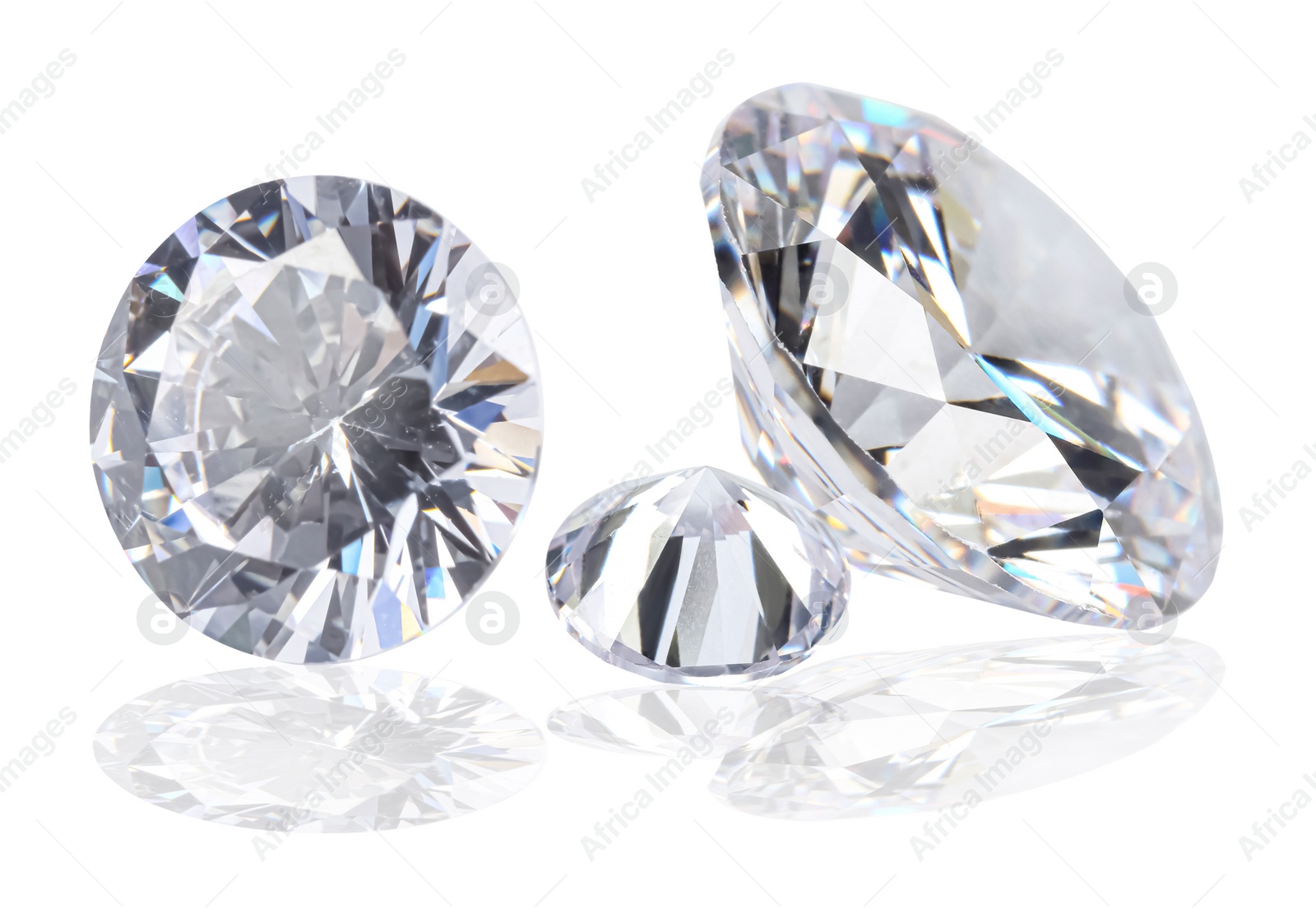 Image of Three beautiful dazzling diamonds on white background