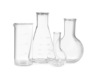 Photo of Many laboratory flasks and beaker isolated on white